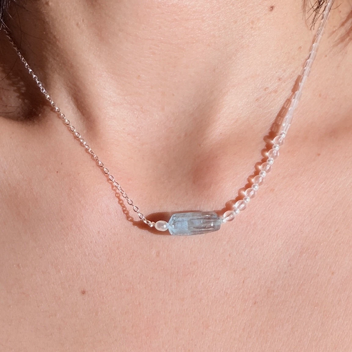 Quiet Current aquamarine necklace worn in natural light
