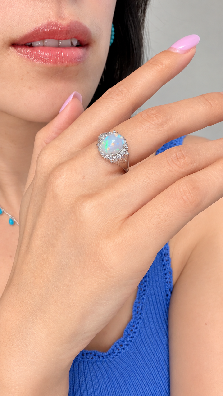 Woman wearing a luminous opal ring
