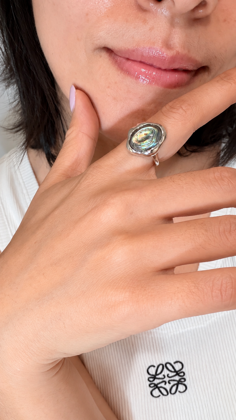 Crystal Wei wearing an iridescent natural shell ring